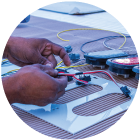 Electrical installers wire a vehicle's lights and other electrical components
